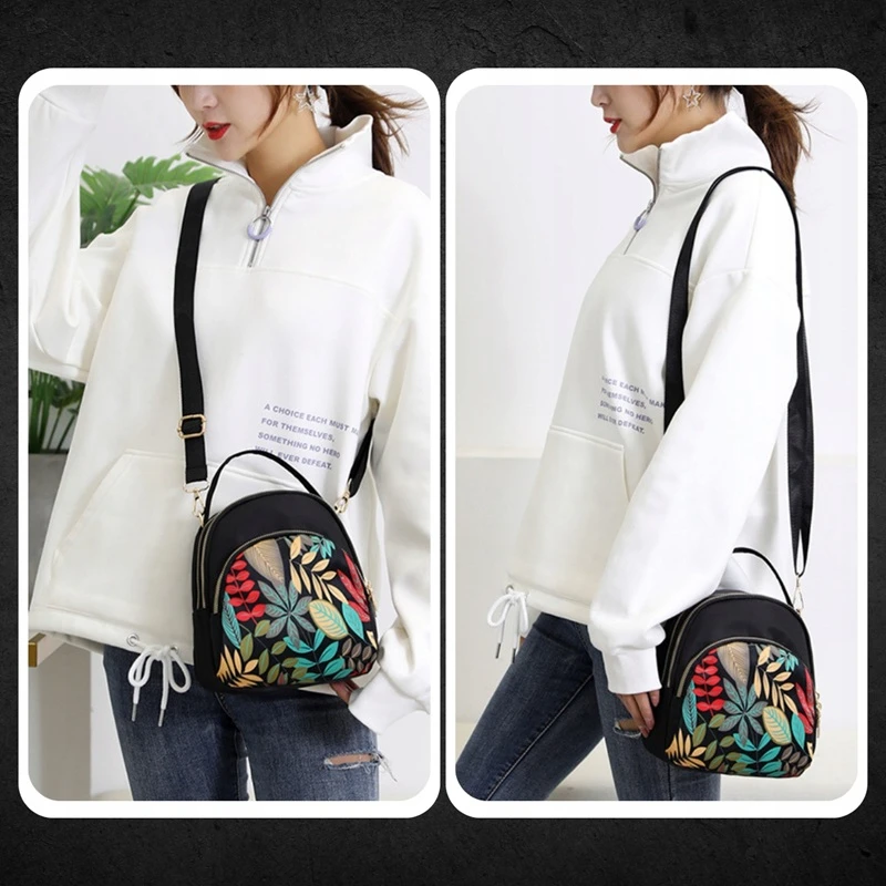 Dámská kabelka LISTEK DK62 nošená jako crossbody přes rameno, moderní černý design s barevným listovým vzorem, ideální pro každodenní městský styl.