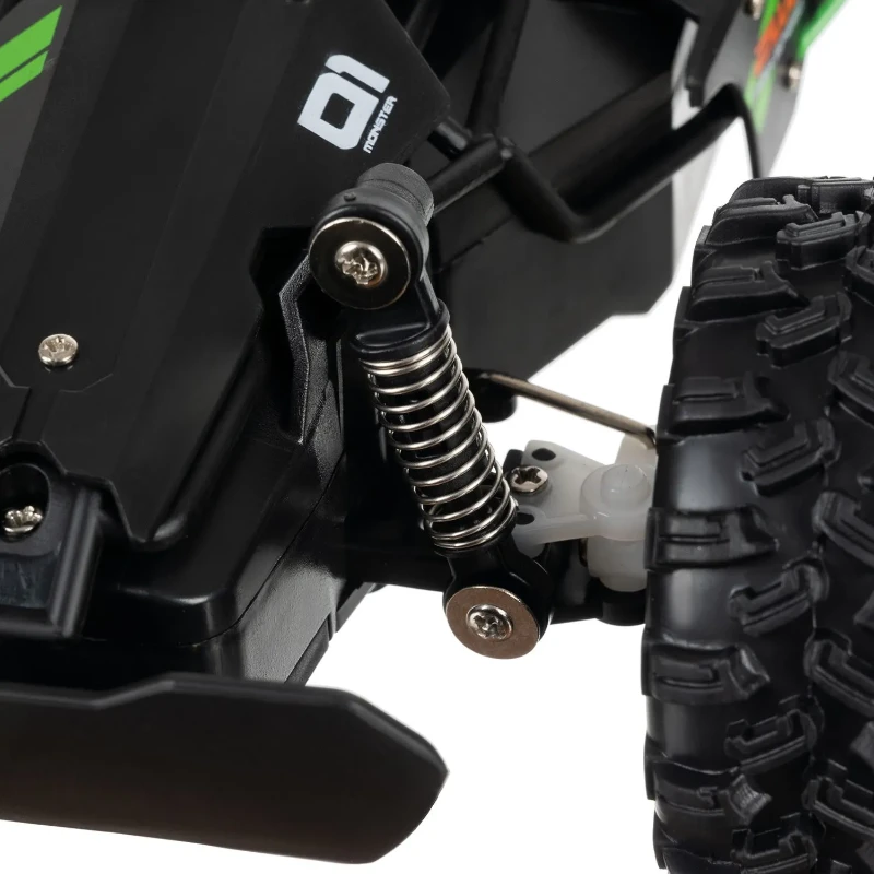 Detail odpružení a tlumiče RC terénního auta Kruzzel 24819 pro stabilní jízdu v náročném terénu.
